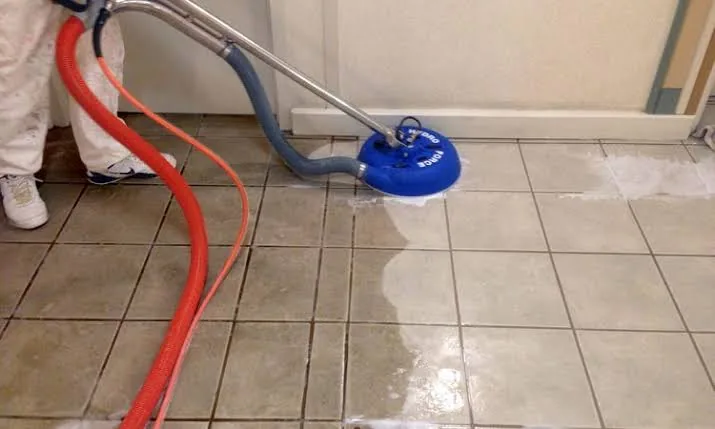 Commercial tile and grout cleaning with a spinner tool and extraction hoses