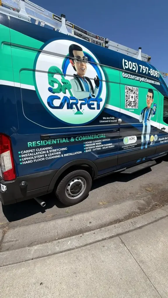 Side of the Dr. Carpet cargo van listing residential and commercial cleaning services