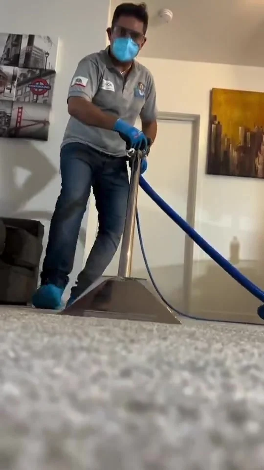 Pedro Andrade of Dr. Carpet performing hot water extraction in a Walnut Creek home