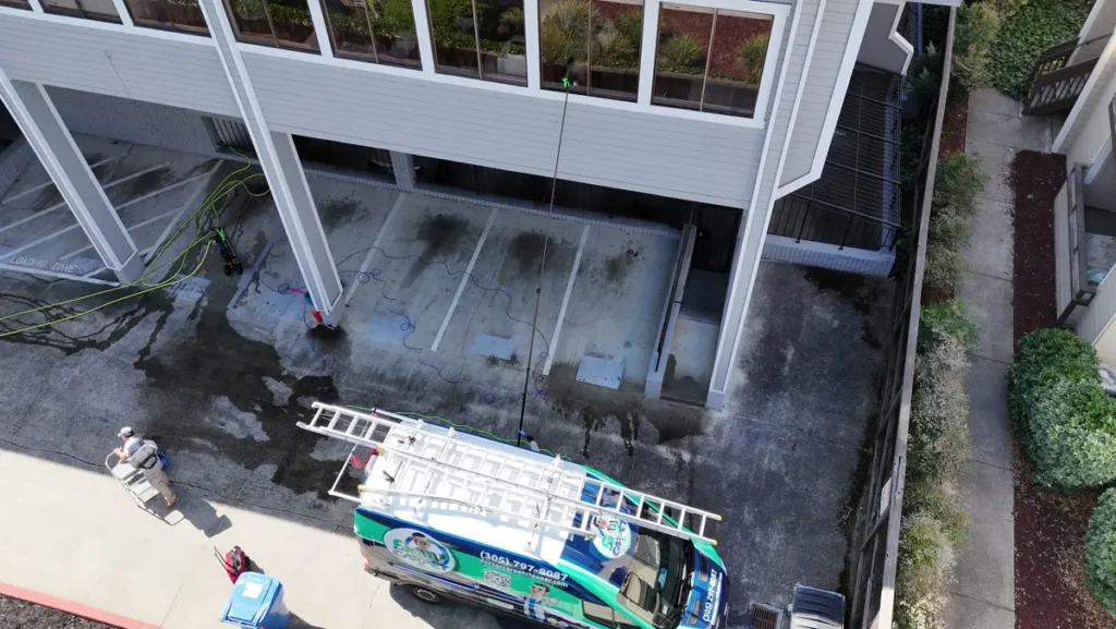 Aerial view of the Dr. Carpet van at a commercial window cleaning job